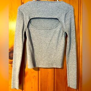 Great shape! Crop style long sleeve with partially open back.